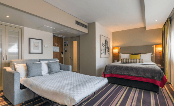 Tower hotel family room with bed and sofa bed