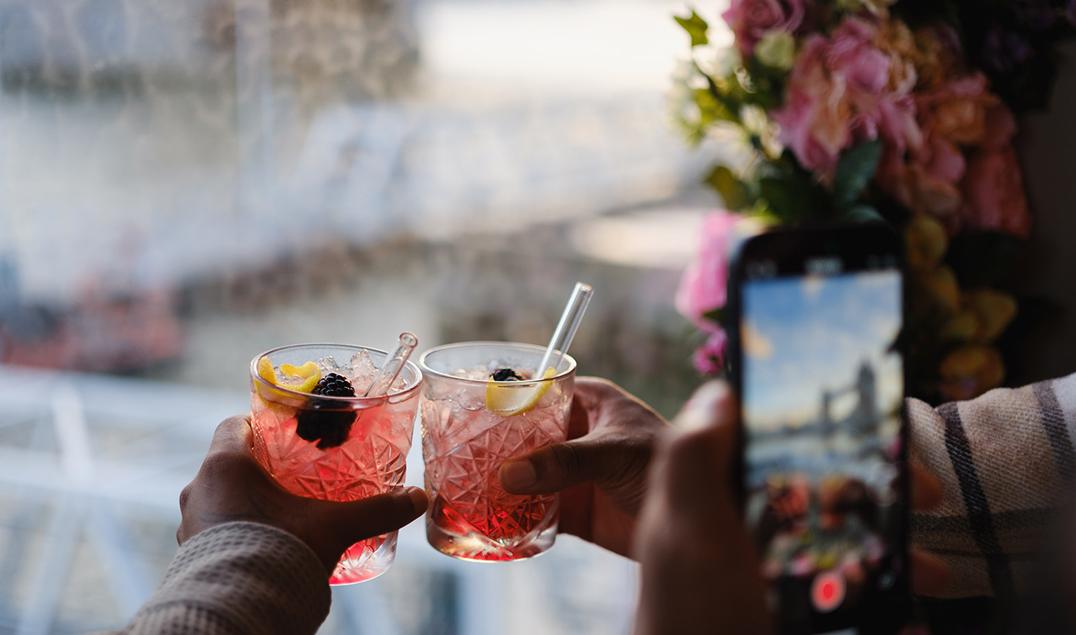 Two cocktails in front of Tower Bridge