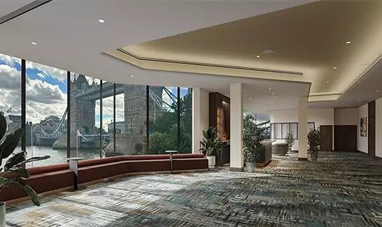 The Bridge suite at The Tower Hotel London, decorated with planters and view of the bar with a view tower bridge behind