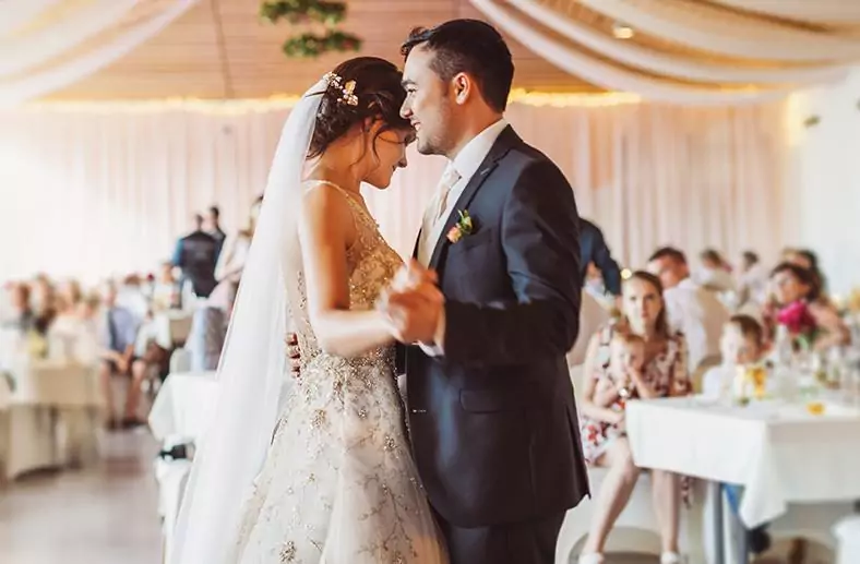 Happy wedding couple dancing - The Tower Hotel