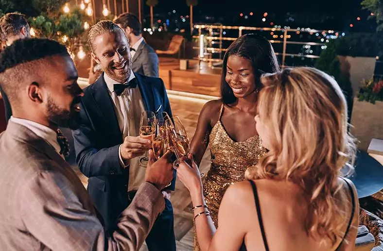People clinking glasses celebrating at an event at The Tower Hotel London