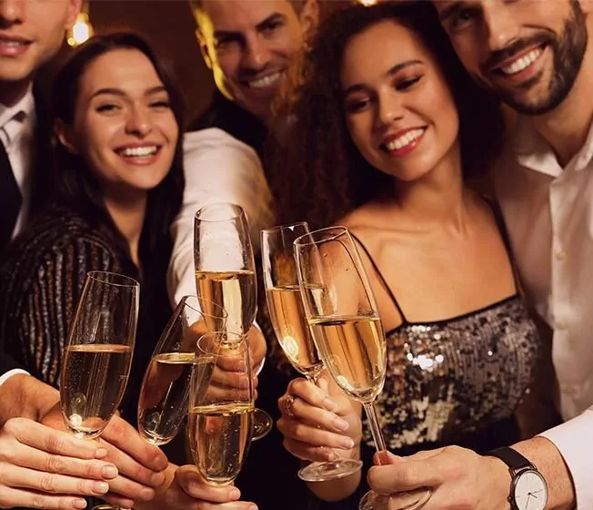People clinking glasses celebrating at an event at The Tower Hotel London