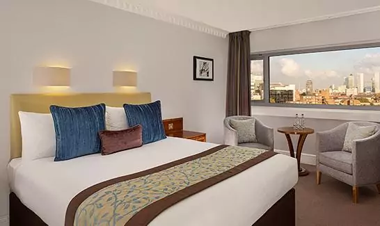 Bed in standard double room - The Tower Hotel