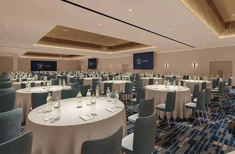The Tower suite at The Tower Hotel London decorated for a cabaret with rows of round tables.