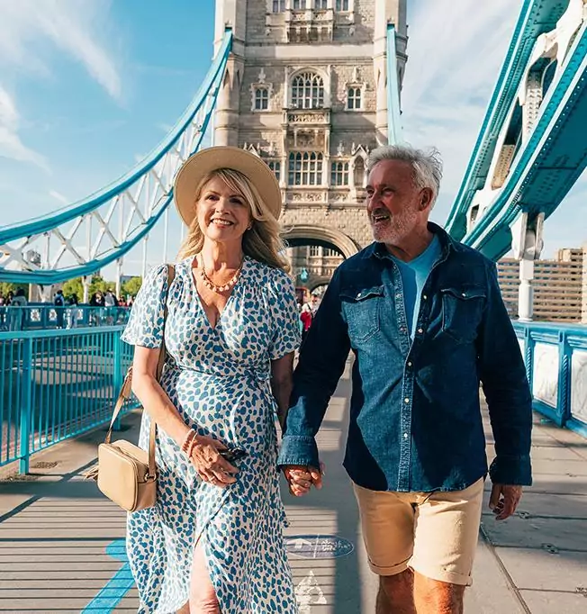 Couple walking across tower bridge